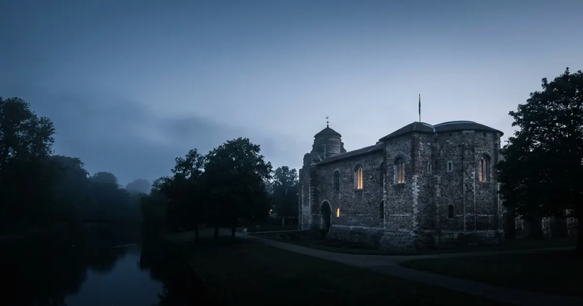 Colchester Castle at dusk, a landmark for local businesses in Colchester, Essex